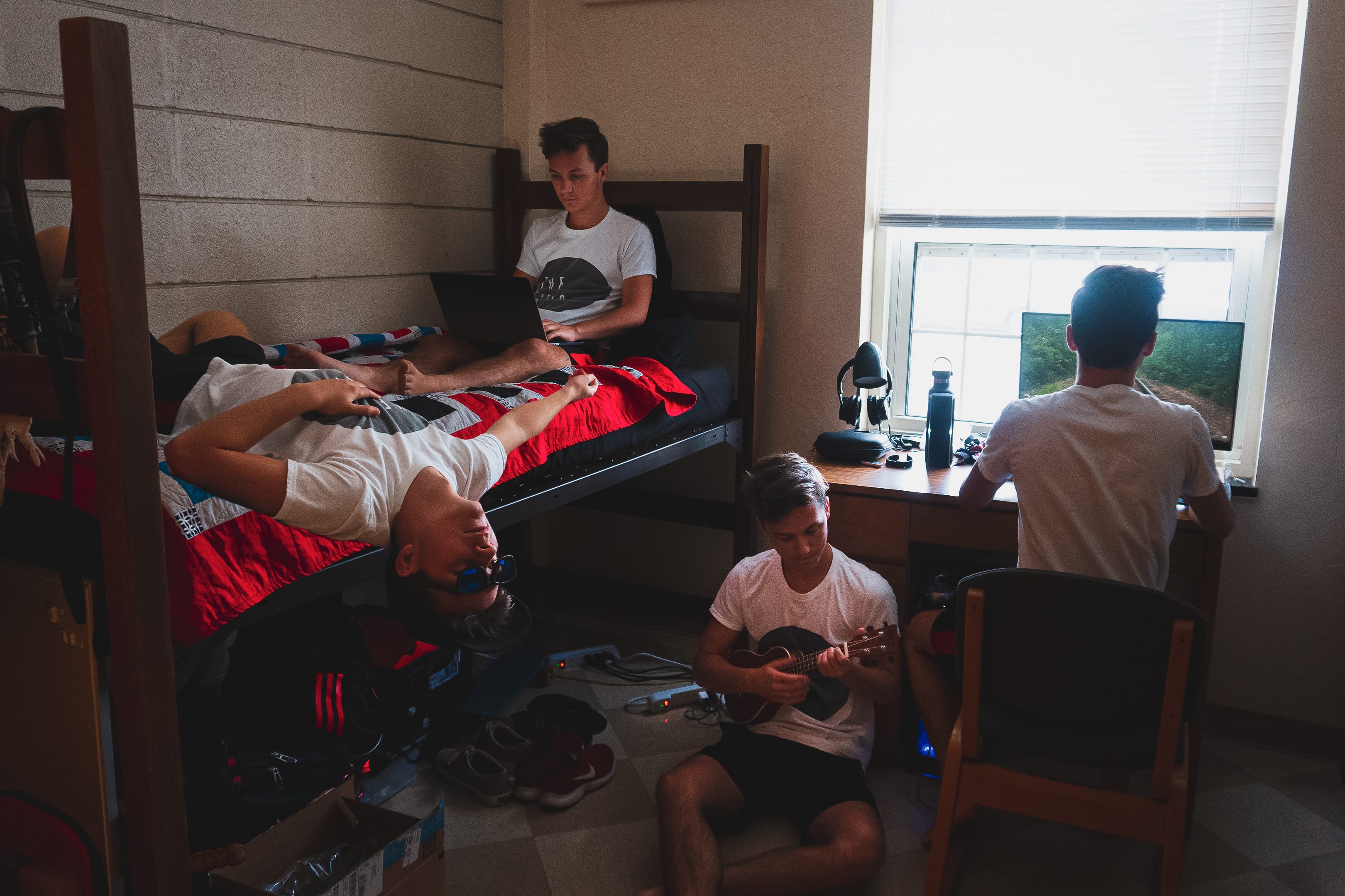 Clones of Bailey doing different things across his dorm room